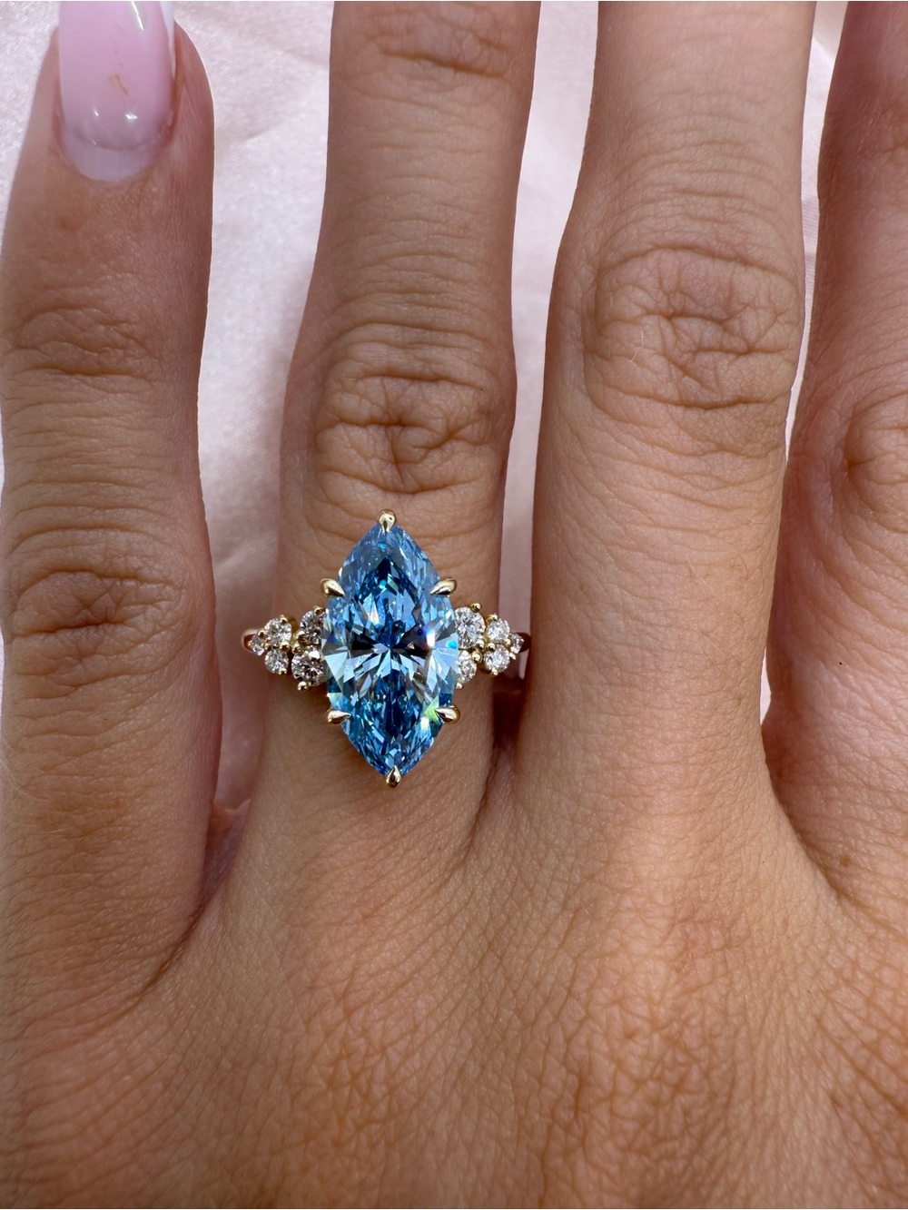 3.10 carat fancy vivid blue VVS2 marquise with accent round diamond band